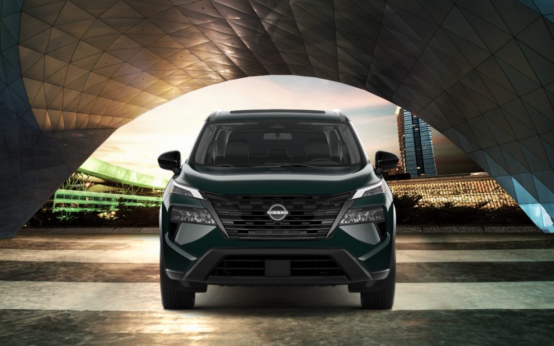 2026 Nissan Rogue Rock Creek shown on a gravel country road with open fields
